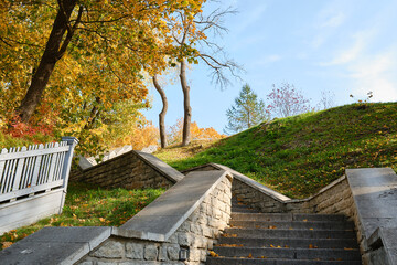 Beautiful staircase in the autumn park. Atmospheric background and texture