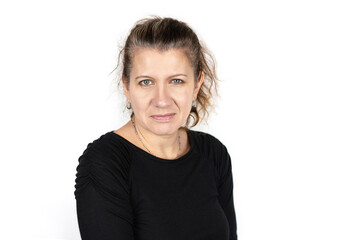 Middle-aged woman on a light background with emotions of frustration, sarcasm on her face. Copy...