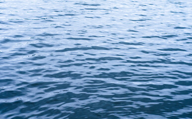 background of pond surface with clear water. small waves on  river.