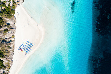 View from above, stunning aerial view of La Pelosa Beach, a white sand beach bathed by a turquoise,...