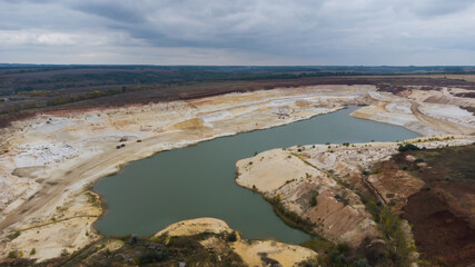 Aerial view of opencast mining quarry. Industrial place view from above. pollution of ecology