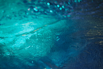 Obraz premium Water blue background with waves and lighting. Neon water texture