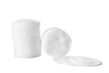 Stacks of clean cotton pads on white background