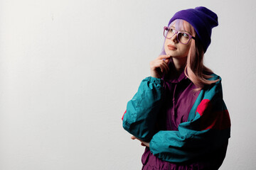 Beautiful woman in glasses and 80s sportsuit