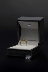 wedding rings in a box, Diamond ring in jewelry gift box on black background