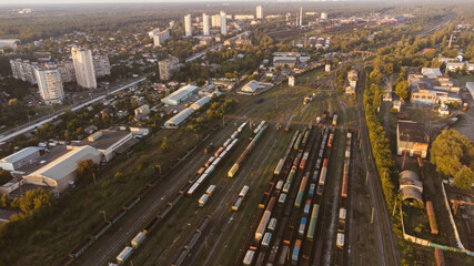 Fototapeta premium Aerial View. Old defective and looted railway wagons stand on the territory of the repair depot awaiting repairs. Poor business management. Ukrainian railway, DVRZ.