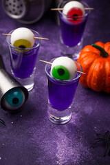 Halloween purple cocktail with eyes.
