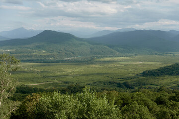 Mountain landscape with green valleys. Caucasian State Natural Biosphere Reserve named after Kh.G. Shaposhnikov. Lago-Naki plateau. Russia.