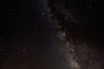 Milky Way galaxy over mountains in the starry night sky. Caucasian State Natural Biosphere Reserve named after Kh.G. Shaposhnikov.