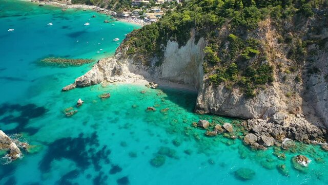 Aerial drone video of tropical paradise turquoise beach with beautiful sky and clouds in Mediterranean destination