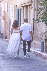 bride and groom walking in the street