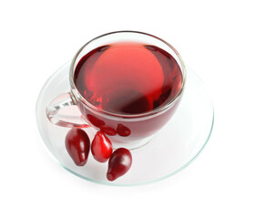 Cup of healthy dogwood berry drink on white background