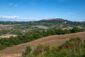Fototapeta na wymiar Montepulciano, Tuscany, Italy. August 2020. Amazing landscape of the Tuscan countryside with the historic village of Montepulciano on the top of the hill. Beautiful summer day.