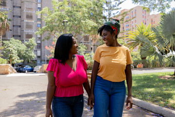 African American friends talking in the park

