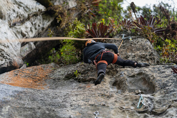 Old man climber on the mountain