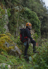 Old man climber on the mountain