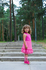 Fototapeta premium little girl in pink dress