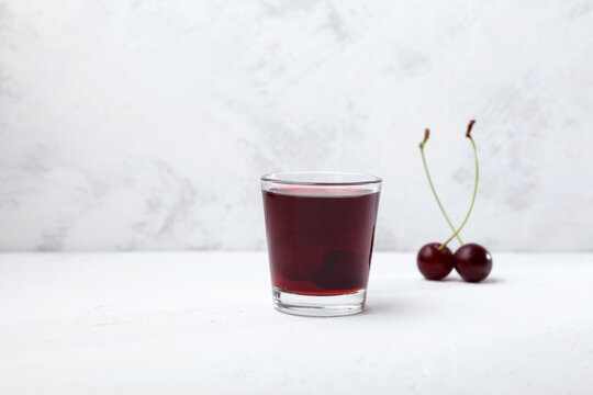 Ginjinha or Ginja - Portuguese liqueur made by infusing ginja berries (sour cherry, Prunus cerasus austera, Morello cherry) in alcohol (aguardente) and adding sugar