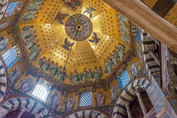 Fototapeta na wymiar AACHEN, GERMANY, 23 JULY 2020 The beutiful golden interior of the Palatine Chapel
