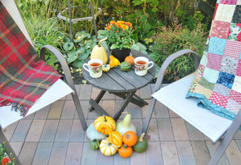 Outdoor patio seating for cozy fall festivals with harvest decorations