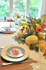 Fall harvest pumpkin and gourds arranged for beautiful seasonal table decor for family Thanksgiving...