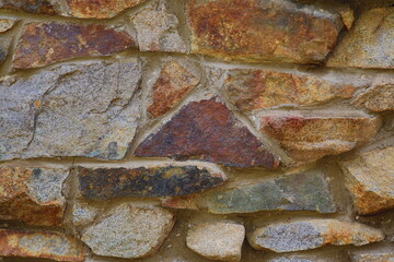 Stone texture in tones of red, brown, and grey