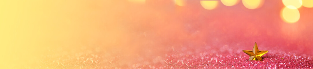 star banner.Christmas and New Year banner.Wallpaper shining glitter.gold star in pink glitter on shining golden bokeh background.Beautiful festive background in rose gold tones.Shining texture. 