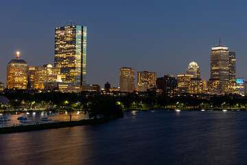Looking over the Charles river at the Boston skyline at night 