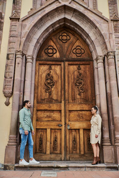 Young Latino Male And Female Couple Looking At Each Other In Love Between 25 And 35 Years Old