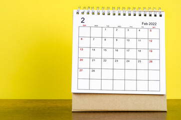 February 2022 desk calendar with yellow background