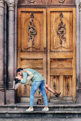 Young latin male and female couple in love kissing between 25 and 35 years old