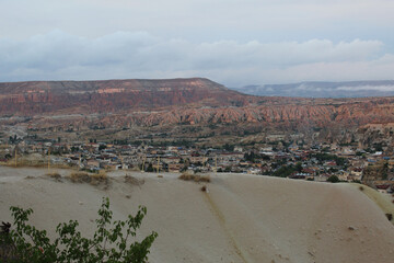 old town in the mountains at sunset, among mountains and rocks