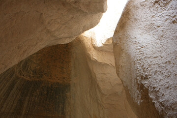 the view from the dark sandy cave up to the exit