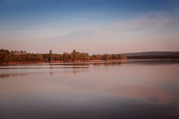 Fototapeta na wymiar Sunset on a pond, river, lake.