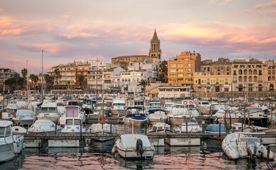 Sunset with the golden sky of the city of Palamós in Girona, Costa Brava.