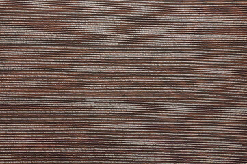 Dark walnut, natural wood surface with deep wavy stripes.