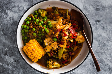 vegan mixed vegetable roast with spicy broth, healthy plant-based food