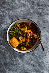 vegan mixed vegetable roast with spicy broth, healthy plant-based food