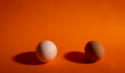 whole eggs on healthy orange background