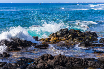 waves crashing on rocks