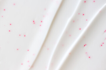 Liquid white creamy texture. Cosmetic texture, close-up. Beauty skincare lotion with selective focus