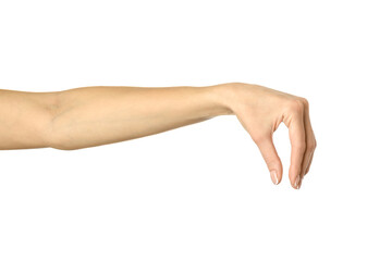 Hand picking, holding, grabbing or reaching. Woman hand gesturing isolated on white