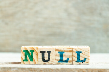 Alphabet letter block in word null on wood background