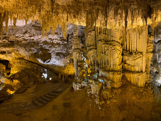 Stalactite and stalagmite formations into the cave at Neptune's Grotto Caves, near Capo Caccia,...