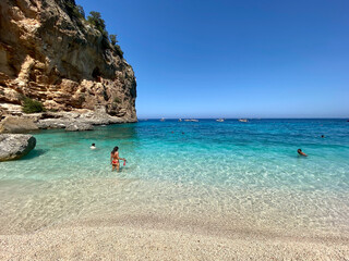 Girl standing on Sardinia Beach Cala Gonone Cala Goloritze Cala Luna