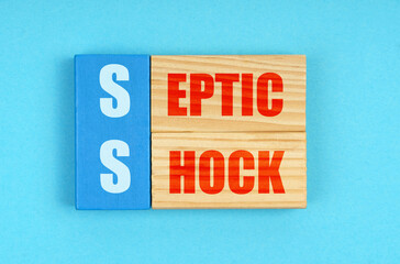 On a blue background, wooden plaques with the inscription - Septic shock