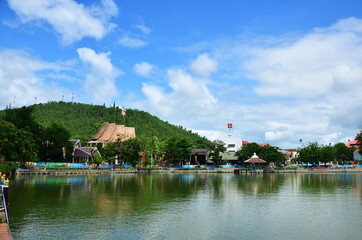 Fototapeta na wymiar View landscape cityscape with mountain forest and Chong Kham pond lake for thai people and foreign travelers travel visit at Maehongson city capital urban on July 17, 2013 in Mae Hong Son, Thailand