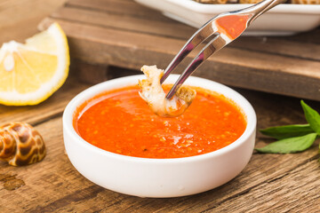 Babylonia areolata shellfish seafood on bowl ready for eat or cooked