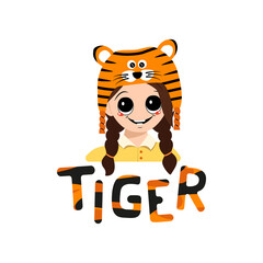 Girl with big eyes and wide smile in tiger hat with lettering. Cute kid with happy face in festive costume for New Year, Christmas and holiday. Head of adorable child with smile emotions