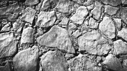 black and white background of old wall stone